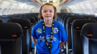 Annabelle smiles in an airplane