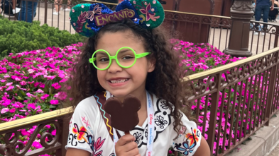 Wish child Avery smiling with her Mickey Mouse ears