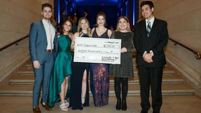 UB School of Pharmacy members with donation check