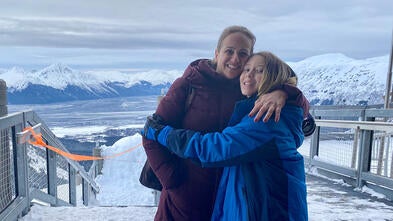 Yuval and mom in front of mountains