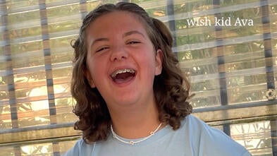 Wish kid Ava smiling and laughing.