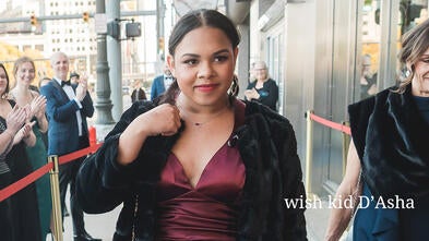 wish kid D'Asha walking the blue carpet like a star model