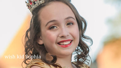 wish kid Sophia is wearing a tiara and a gold princess outfit. 