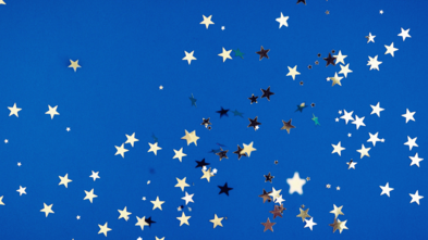 Star confetti on blue background