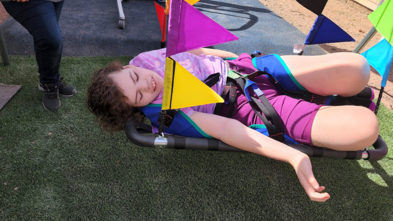 Lily loves her new adaptive swing where she can lay down and sway.