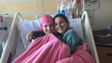 Elizabeth and sister in hospital bed