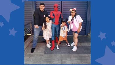 Leonel with his mom, Selene, dad, Alexis, and sister, Miranda with Spider-Man on his wish to go to Disneyland.