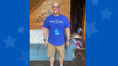 Man wearing Make-A-Wish North Texas shirt and khaki shorts