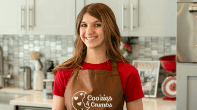 Neysa standing in her kitchen