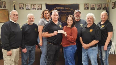 From left to right: Joe Cianflone, John Szymanski, bar manager, Gina Stombaugh, Post Adjunct Commander, Joe Kugler, Make-A-Wish Regional Manager, Maggie O'Brien, Post Vice Commander, Bob Novajosky, Post Commander, Mark Sedlak, bartender, Anna Wheeler.  