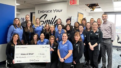 The staff of GKG Orthodontics presents its donation to wishes.