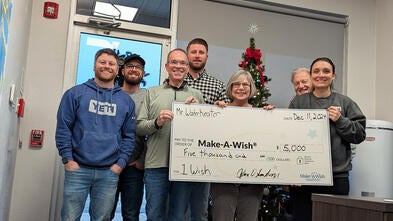 Pictured are employees of Mr. Waterheater presenting a donation to Stephanie Pugliese, Make-A-Wish director of development.