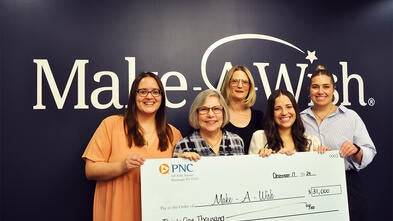 Pictured is Stephanie Pugliese, director of development with the PNC Treasury Management Golf Committee lead by chair Charlee Brindza making a presentation of $31,000. 