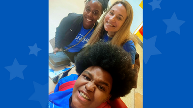 three people smiling at the camera