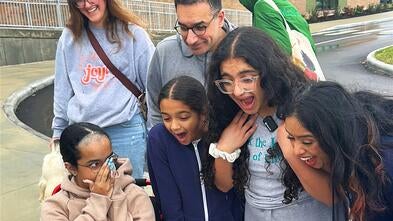 The Faruqui Family reacts with surprise and excitement learning that their family won the "Indominable Spirit" award.