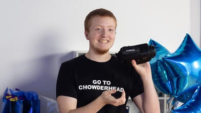 Hunter Smiling with a New Camera
