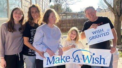 photo of Oliana and her family on wish day