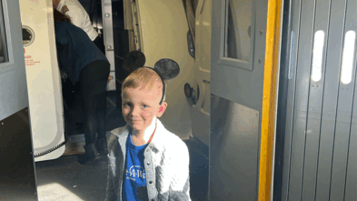 Leif boarding airplane