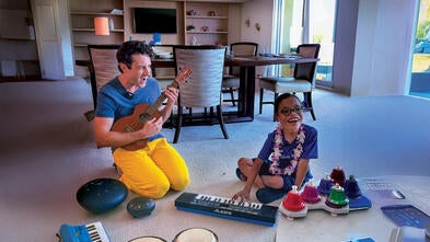 Atticus and Mr. Rob playing instruments and making music