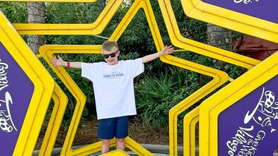 Wish Kid Noah smiles at Give Kids the World Village