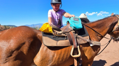 Olivia horseback riding during her wish