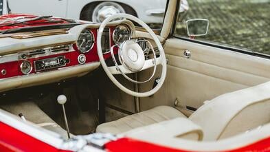 Classic red car interior in the daylight 