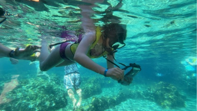 Grace scuba diving in Aulani