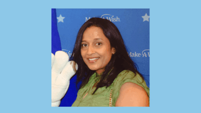 Dr. Dharia smiling in a photo