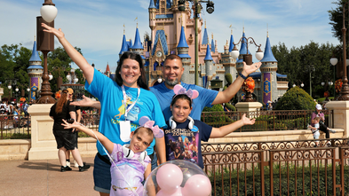 Valentina and family in front of Disney Castle