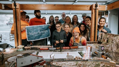 Honour and guests smiling in front of completed transet