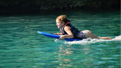 Cora boogie boarding in the Bahamas