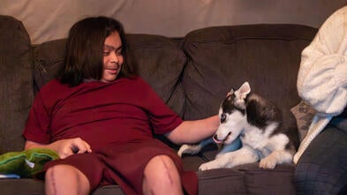 Brian playing with his new puppy.