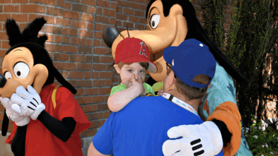 Lucas hugging Goofy