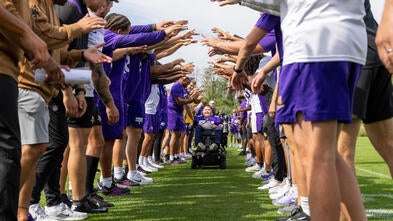 Nash wheeling through a tunnel of vikings players