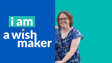 Kate in front of a teal background