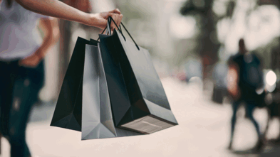 Someone holding shopping bags