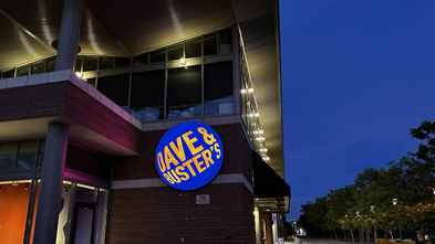 Dave & Busters sign on the outside of the building at night