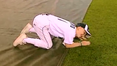 Katie feels the grass at Safeco Field