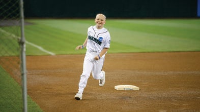 Katie Morris runs the bases at the Mariners Game