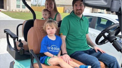 Conrad on his golf cart