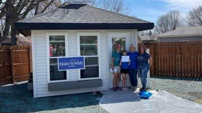 Wish kid Sophia standing in front of her new gazebo