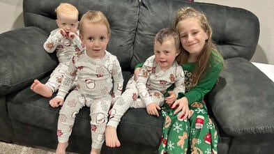 Wish alumni Isaac with his siblings enjoying the home theater from his wish