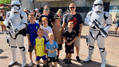Knox and family posing with storm troopers at Disney
