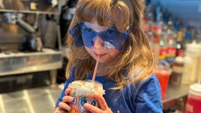 Wish Kid Abigail drinking Dutch Bros