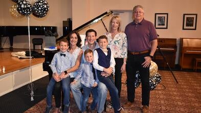 Wish kid Gavin with his family for his wish
