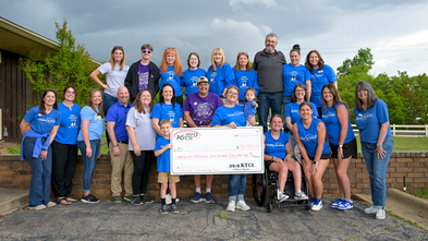 KTCS 2026 Event photo with grand total outside station