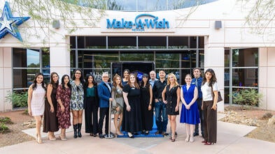 Make-A-Wish Nevada staff standing in front of their building