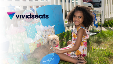 Wish kid Nyla with her dog; Vivid Seats logo superimposed on top left corner of the image