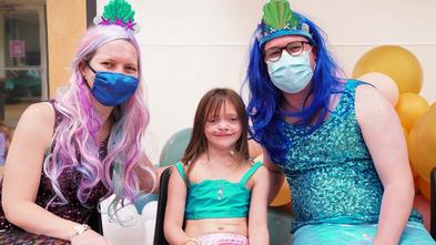 Wish child Caitlyn with her doctors from Boston Children's Hospital