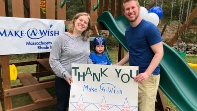 WIsh child Conor receiving his playset